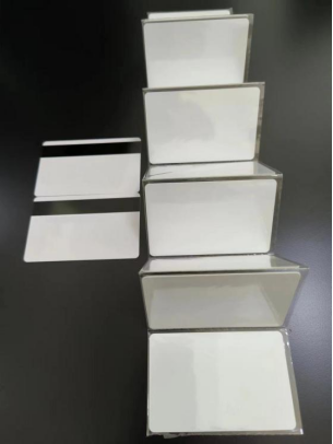 Close-up of blank white PVC card front surface showing smooth matte texture, CR80 size 86x54mm, 0.76mm thickness for ID card printing