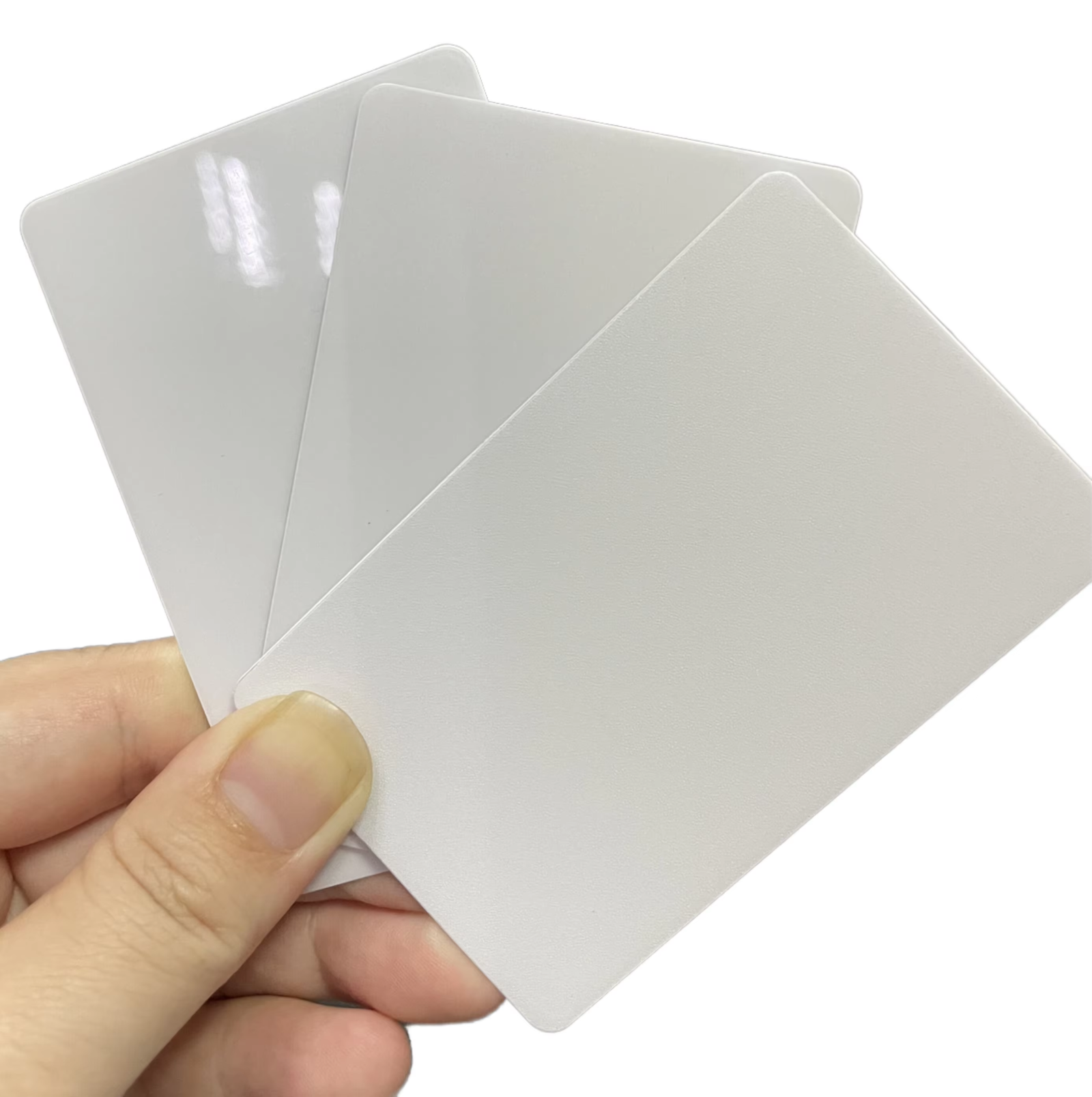 Close-up of blank white PVC card front surface showing smooth matte texture, CR80 size 86x54mm, 0.76mm thickness for ID card printing