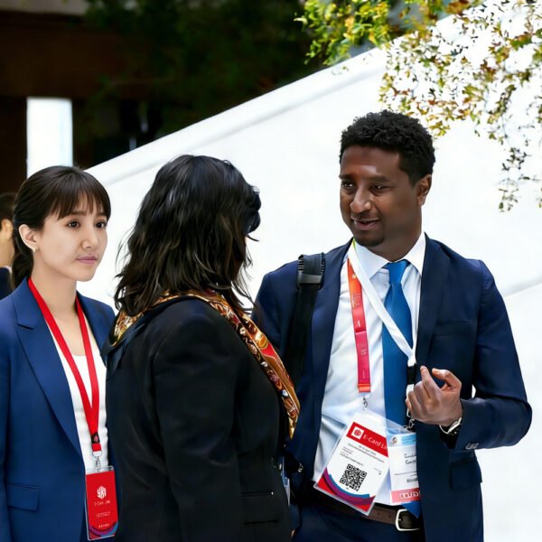 Business professionals wearing conference event ID badges with lanyards during an exhibition or corporate event